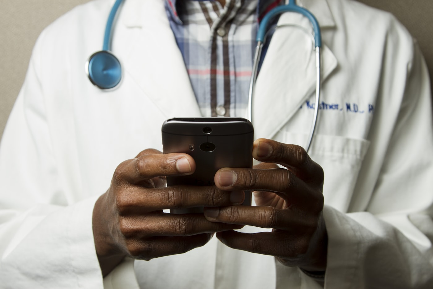 Clinician reviewing and editing an AI-generated clinical note on a laptop